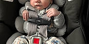 Devin is registered to the contest to win money with this photo: baby, sleeping, car_seat, pajamas, hat, infant, child, safety_harness, cute, soft_lighting, indoors, adorable, resting, toddler, clothing, fabric, comfort, seat, headwear, peaceful