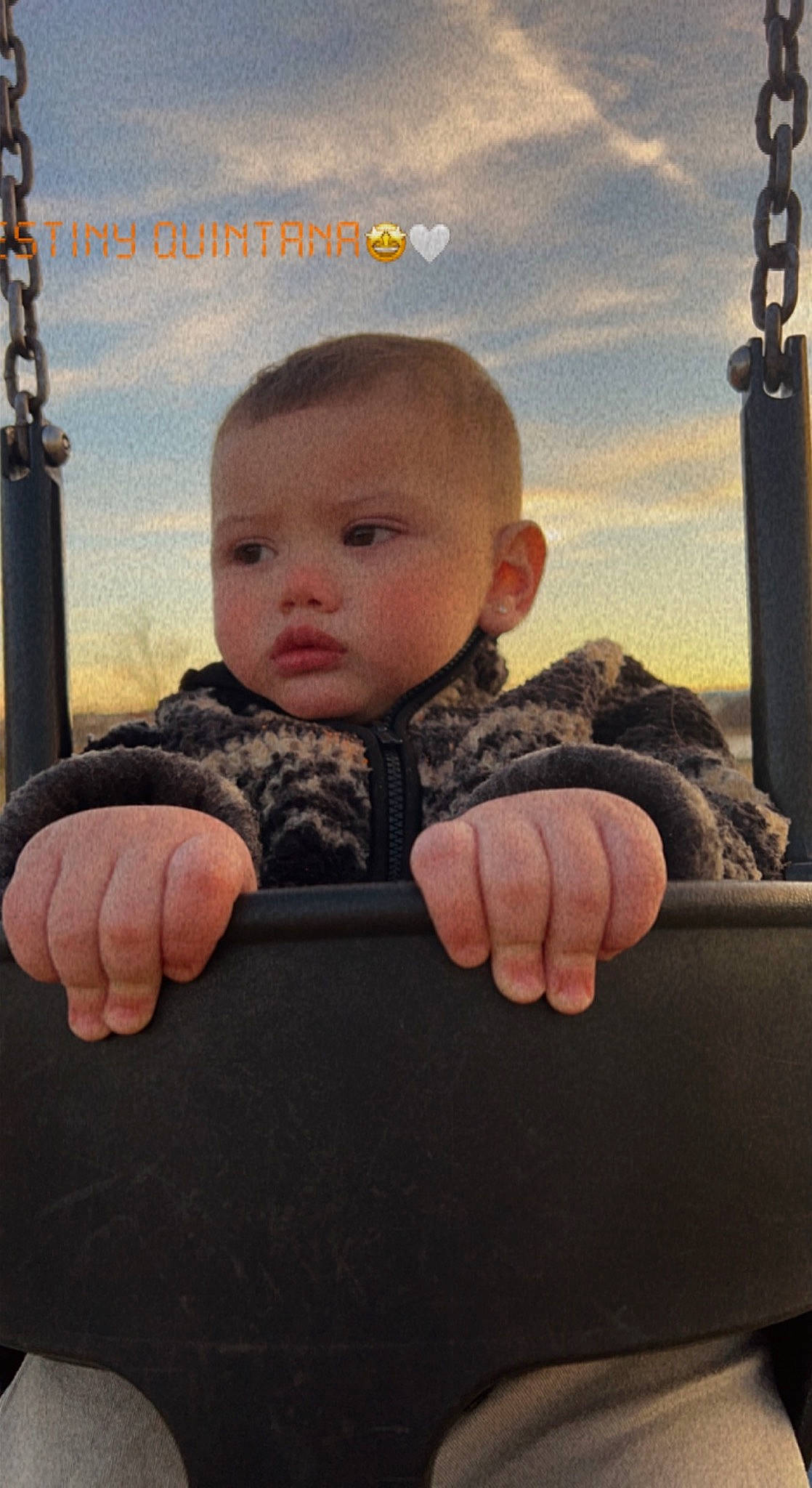 Amoni is registered to the contest to win money with this photo: art, baby, baby_toddler_clothing, cheek, child, chin, cloud, finger, flash_photography, fun, gesture, grass, happy, people_in_nature, person, sitting, sky, sleeve, thumb, toddler