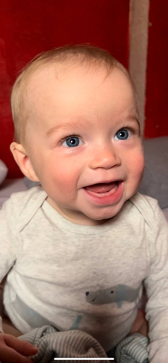 Makai is registered to the contest to win money with this photo: baby, baby_toddler_clothing, cheek, chin, ear, eyebrow, eyelash, facial_expression, forehead, hairstyle, iris, lip, mouth, nose, person, skin, sleeve, smile, standing, toddler