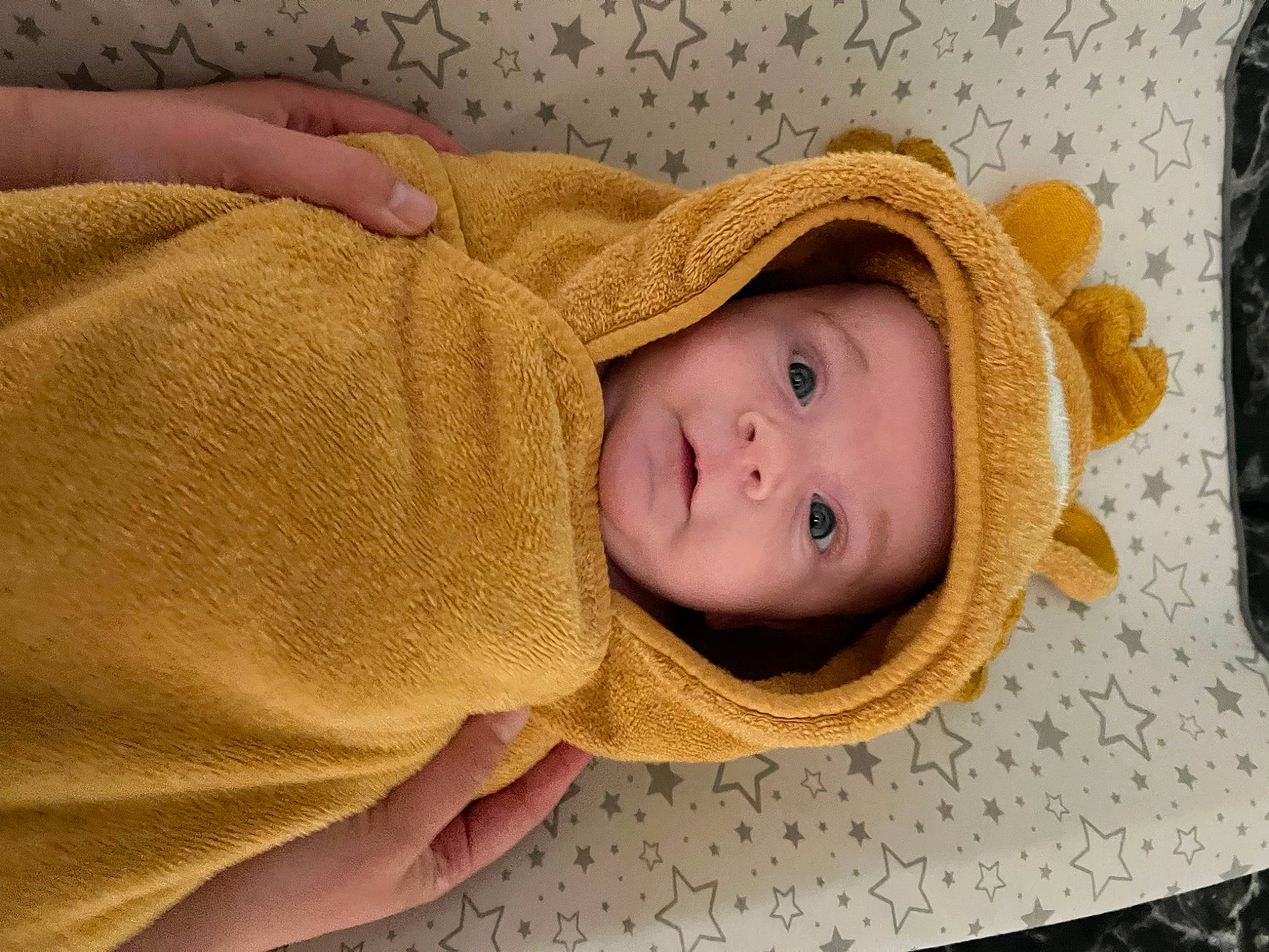 George joined the competition — help win amazing prizes! baby, baby_toddler_clothing, cap, cheek, child, chin, comfort, facial_expression, flooring, hat, headgear, headwear, linens, nose, person, skin, sleeve, smile, sun_hat, toddler