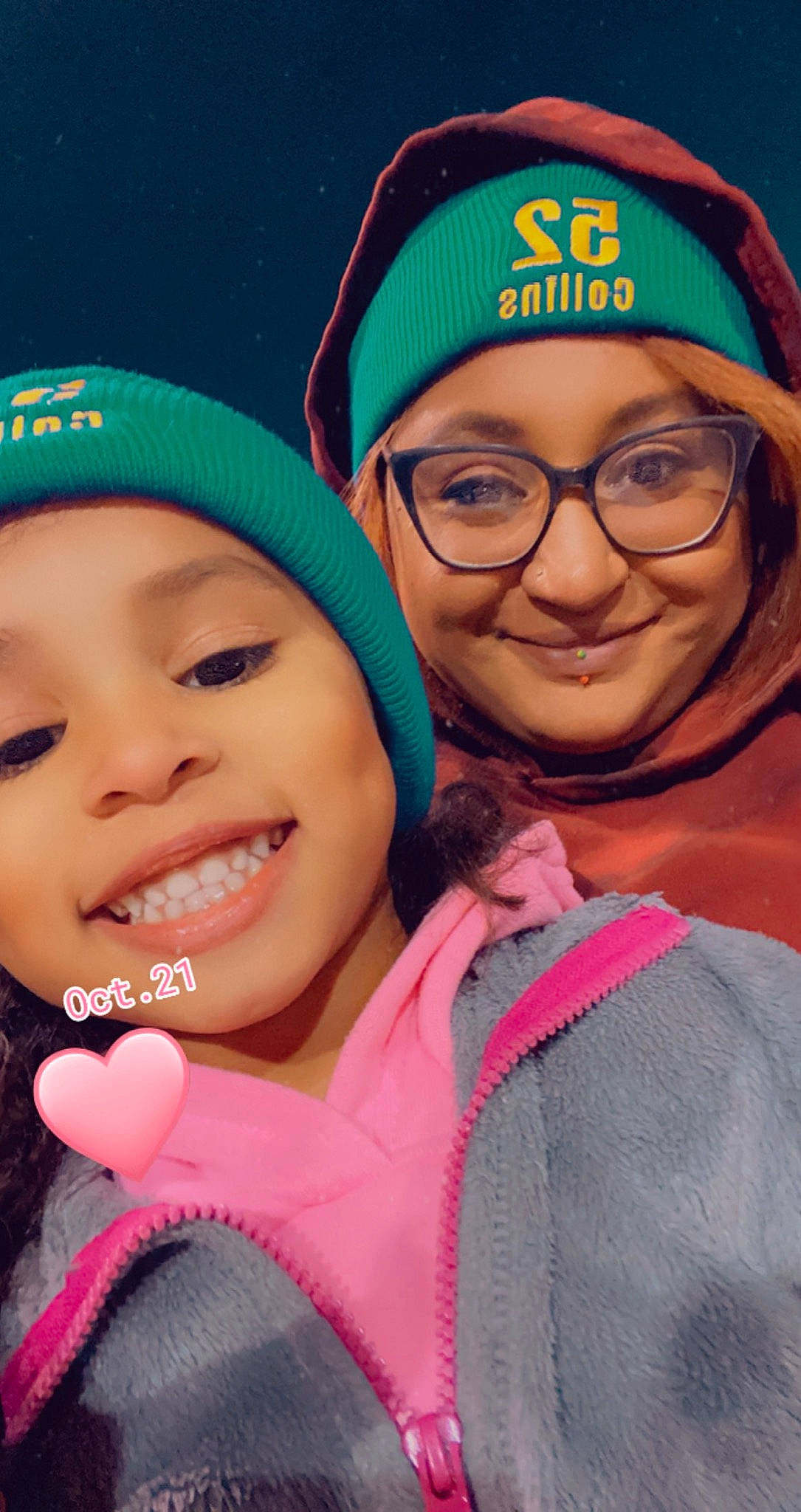 Leia is registered to the contest to win money with this photo: baseball_cap, cap, cool, eyebrow, face, facial_expression, friendship, fun, happy, headgear, headwear, human, joy, leisure, mouth, outerwear, person, pink, product, selfie