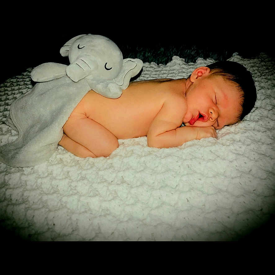 Elijah joined the competition — help win amazing prizes! baby, bed, bedroom, blanket, bodypart, face, finger, furniture, hand, happy, head, indoors, newborn, person, photography, portrait, room, sleeping, smile, towel