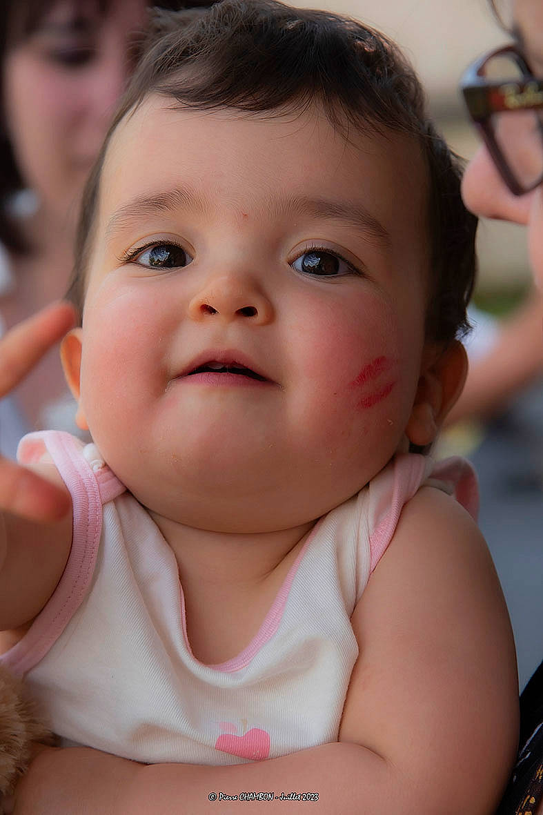 Nelia participe au concours pour gagner de l'argent avec cette photo : baby, baby_toddler_clothing, cheek, chin, eyebrow, eyelash, facial_expression, finger, fun, gesture, hand, happy, human, iris, lip, mouth, nose, person, pink, skin