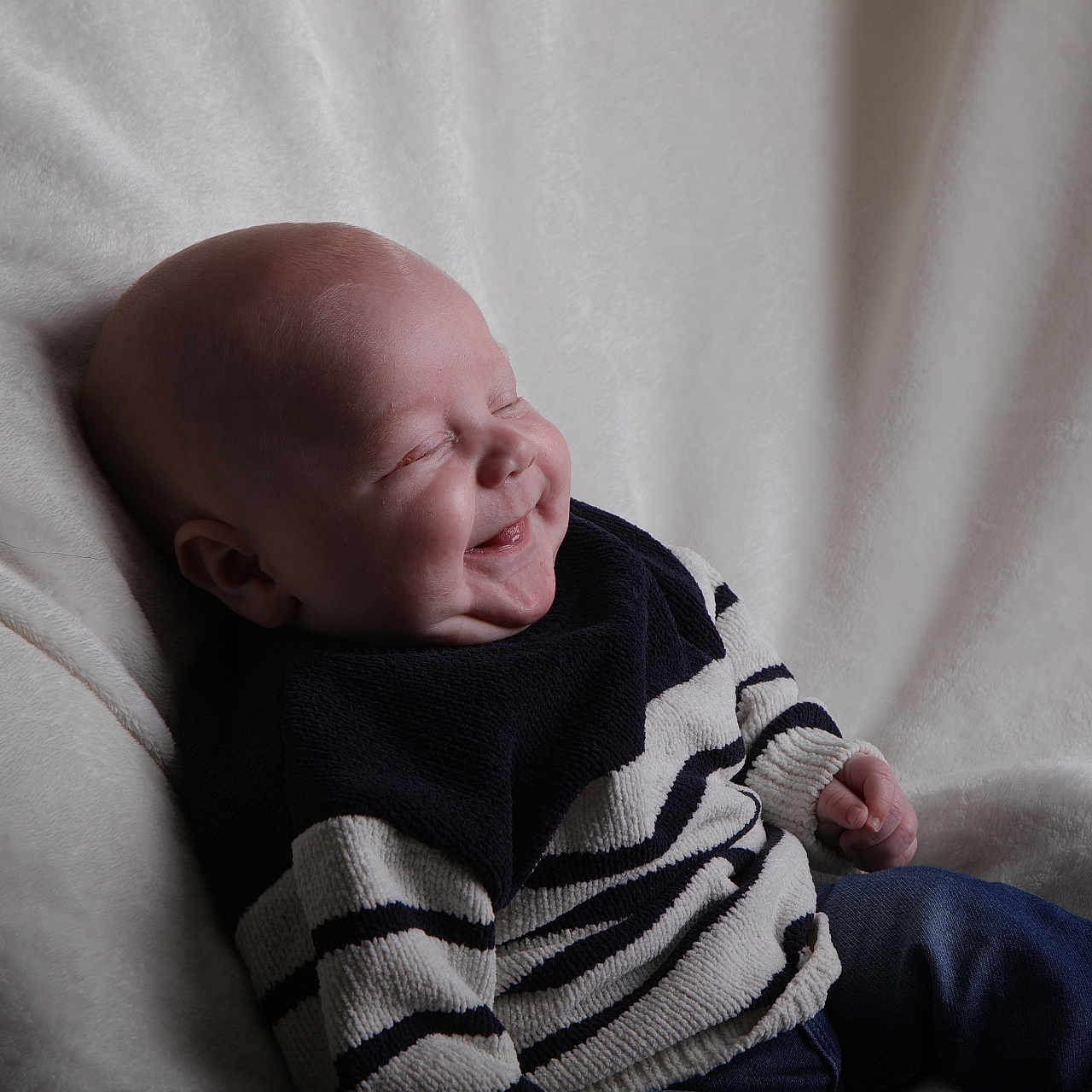Oliver joined the competition — help win amazing prizes! baby, blanket, bodypart, clothing, couch, face, finger, furniture, hand, head, hoodie, knitwear, newborn, person, photography, portrait, sweater, sweatshirt, toe, towel