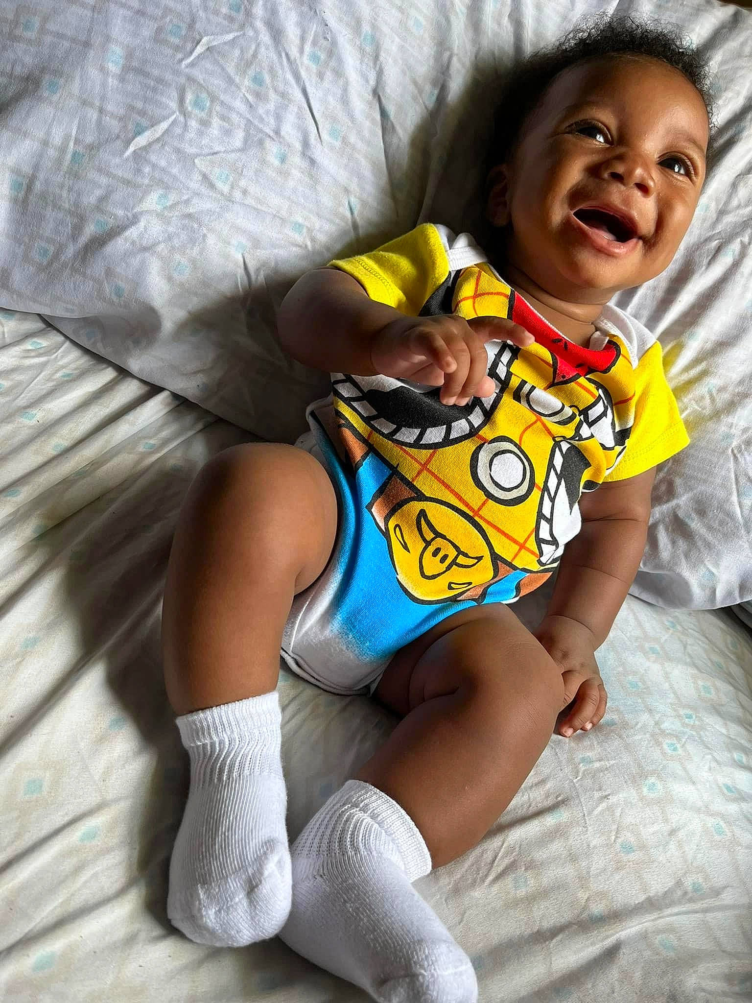 Jasani joined the competition — help win amazing prizes! arm, baby, baby_toddler_clothing, chair, eye, happy, human_body, human_leg, jersey, knee, leg, person, sitting, sleeve, smile, sock, sports_uniform, sportswear, t_shirt, thigh