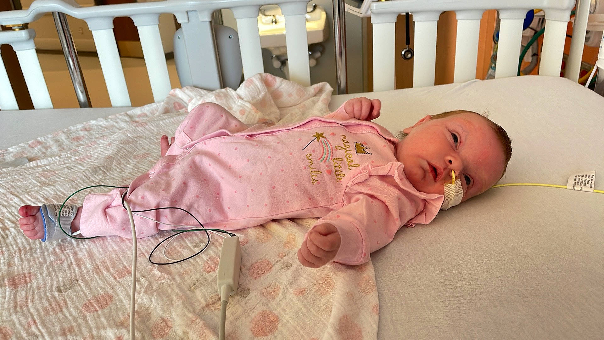 Stella joined the competition — help win amazing prizes! baby, baby_safety, baby_toddler_clothing, bed_sheet, bedding, bedtime, child, comfort, flooring, linens, mammal, nap, person, pink, room, sitting, skin, sleep, textile, toddler