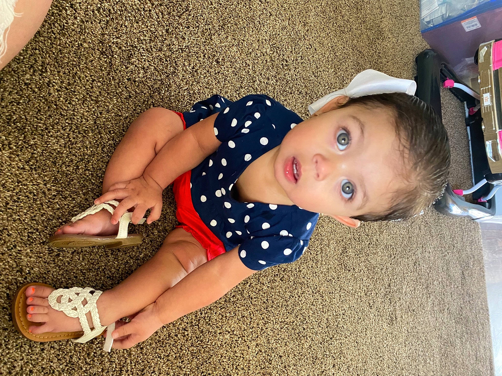 Mallory joined the competition — help win amazing prizes! baby, baby_toddler_clothing, calf, child, electric_blue, fashion_accessory, flooring, foot, fun, grass, happy, hat, human_leg, joint, knee, pattern, person, sitting, sleeve, surprise