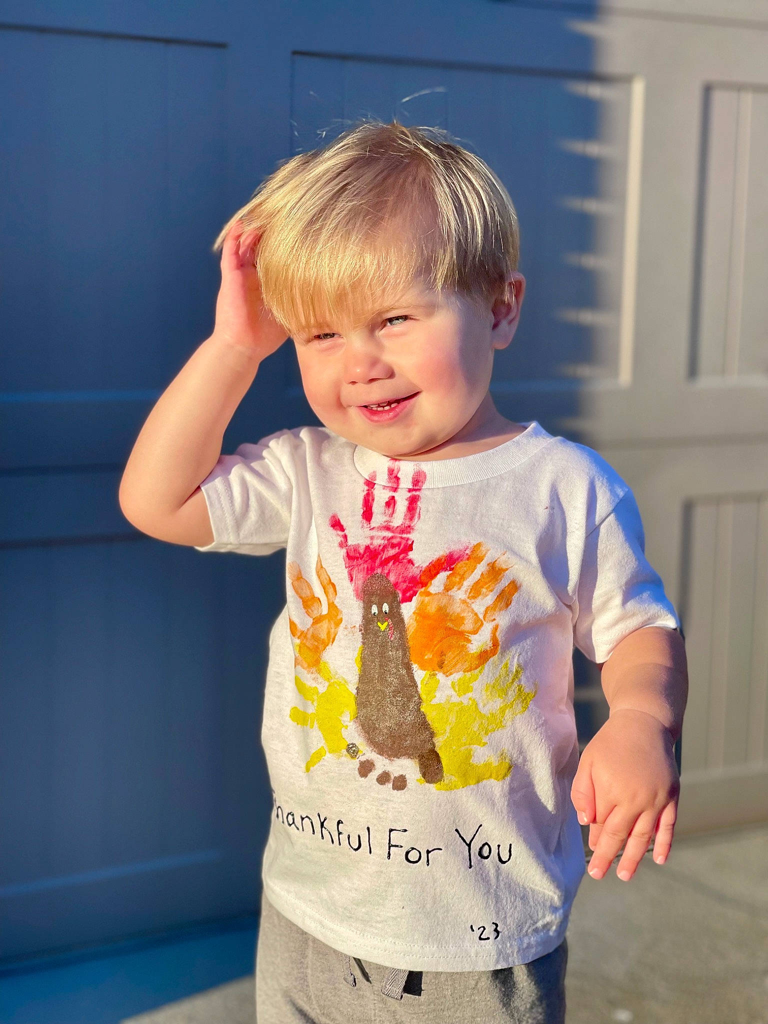 Henry is registered to the contest to win money with this photo: baby_toddler_clothing, child, cool, door, electric_blue, face, fun, hair, hand, happy, head, joy, pattern, person, play, sitting, sleeve, smile, standing, t_shirt