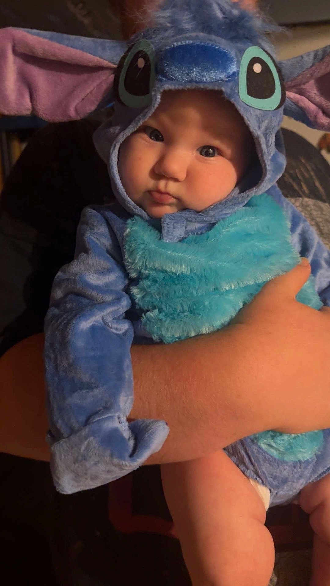 Katherine is registered to the contest to win money with this photo: baby, child, costume, blue, plush, cute, face, person, portrait, indoor, arm, hand, disney, character, soft, clothing, infant, expression, eyes, pout