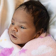 Arielle joined the competition — help win amazing prizes! baby, infant, blanket, pink, soft, face, head, skin, hair, newborn, sleepy, cozy, warm, closeup, portrait, child, wrapped, cute, indoors, expression