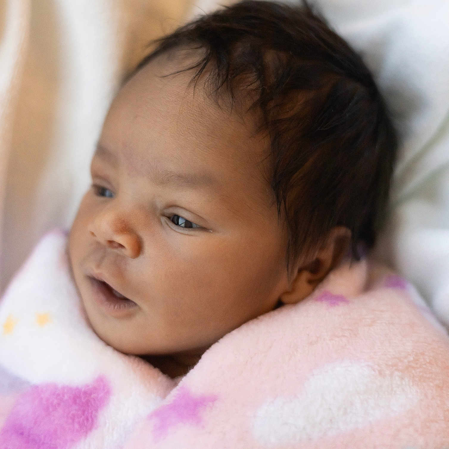 Arielle joined the competition — help win amazing prizes! baby, blanket, child, closeup, cozy, cute, expression, face, hair, head, indoors, infant, newborn, pink, portrait, skin, sleepy, soft, warm, wrapped