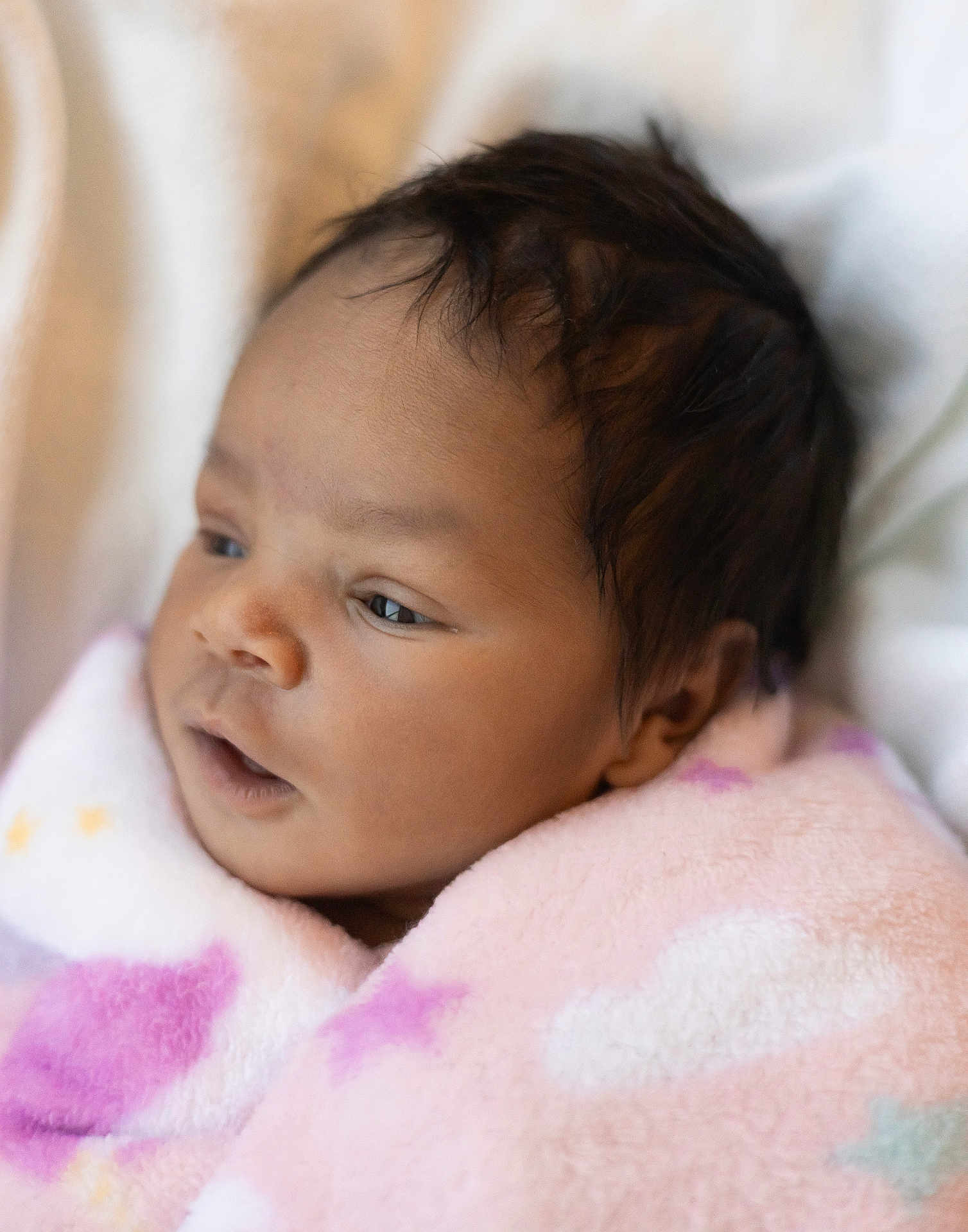 Arielle joined the competition — help win amazing prizes! baby, infant, blanket, pink, soft, face, head, skin, hair, newborn, sleepy, cozy, warm, closeup, portrait, child, wrapped, cute, indoors, expression