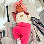 Dynasty is registered to the contest to win money with this photo: newborn, baby, infant, pink, headwrap, bow, onesie, pants, socks, mittens, sleeping, bassinet, hospital, blanket, wristband, crib, portrait, soft_lighting, cute, tiny_hands