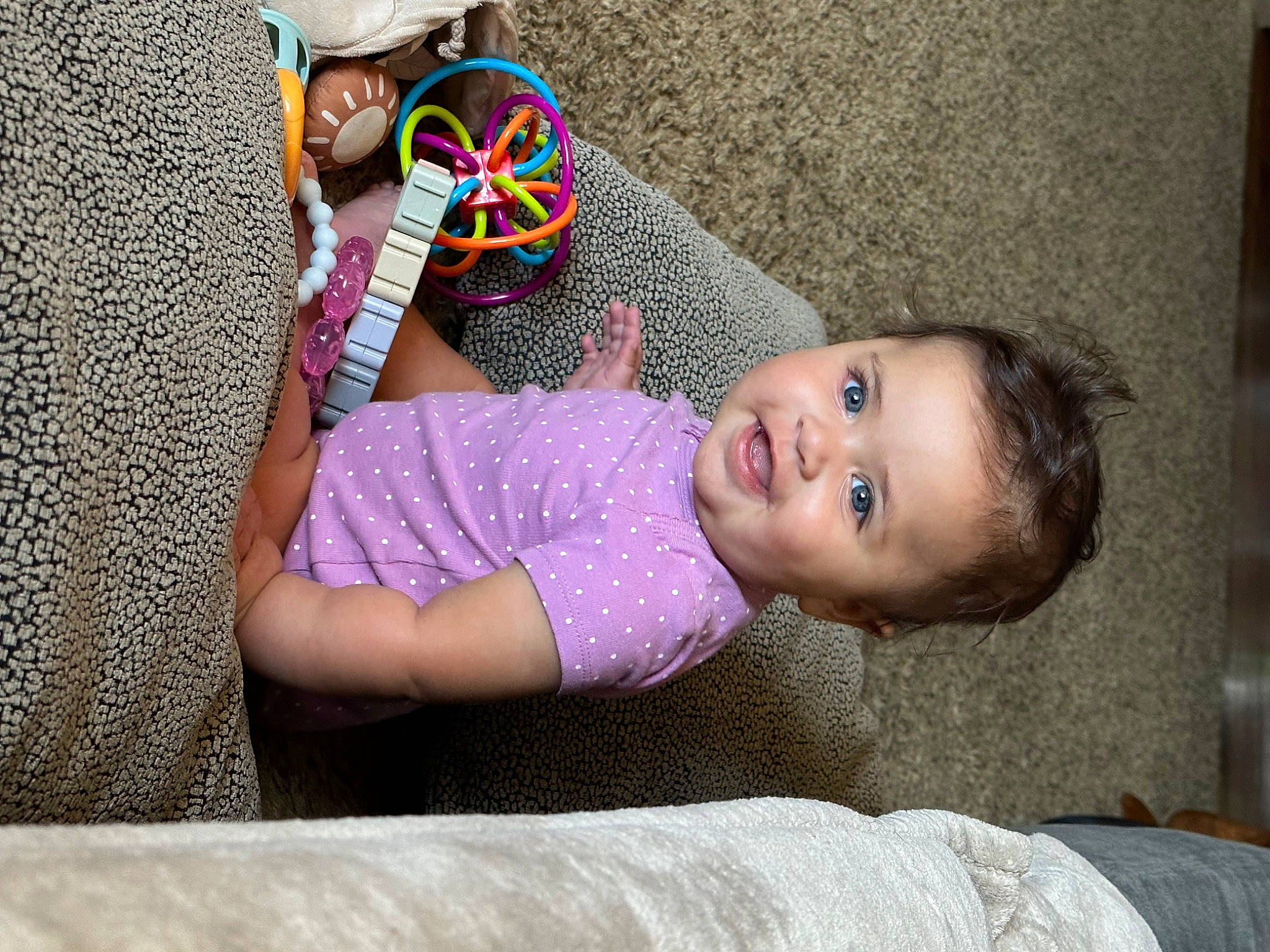 Charlotte-grace is registered to the contest to win money with this photo: baby, baby_toddler_clothing, cap, child, face, fashion_accessory, fun, grass, happy, hat, headgear, joy, leisure, party_supply, pattern, person, personal_protective_equipment, sitting, smile, sun_hat