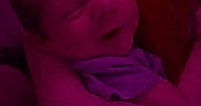 Cole is registered to the contest to win money with this photo: arms, baby, blanket, child, close_up, clothing, cuddling, dim_lighting, face, family, head, indoor, infant, mouth, nose, portrait, purple_lighting, seated, sleeping, snuggling