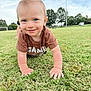 toddler, child, grass, outdoor, crawling, smiling, blue_eyes, short_hair, mohawk, park, trees, soccer_goal, field, daylight, casual_clothing, cute, happy, person, nature, playful