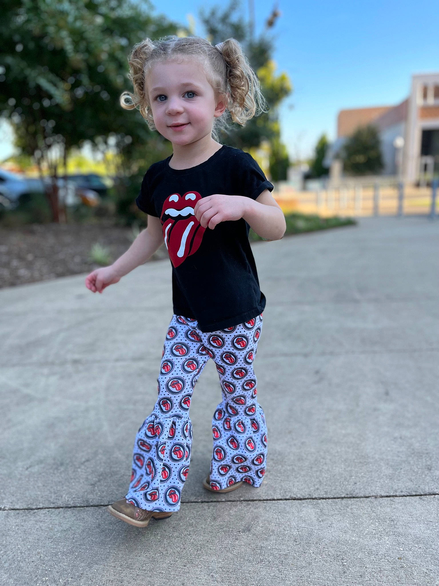 Serenity is registered to the contest to win money with this photo: arm, asphalt, baby_toddler_clothing, child, denim, electric_blue, fun, grass, happy, joy, leisure, pattern, person, plant, recreation, sky, sleeve, sportswear, t_shirt, toddler