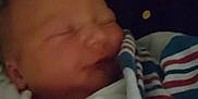 Mckenzie is registered to the contest to win money with this photo: baby, blanket, child, closeup, cozy, dark, face, hands, hospital, human, infant, newborn, peaceful, person, portrait, rest, sleep, sleeping, soft, wrapped