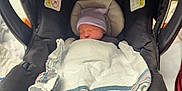 Mckenzie joined the competition — help win amazing prizes! newborn, baby, car_seat, chicco, blanket, hat, sleeping, infant, child, resting, indoor, soft_lighting, tender, swaddled, comfortable, black, fabric, safety_belt, cute, peaceful