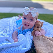 Cirilla joined the competition — help win amazing prizes! baby, blue_eyes, bow, blanket, grass, outdoor, stuffed_animal, toy, smile, happy, child, infant, cute, headband, clothing, person, portrait, lying_down, nature, sunlight