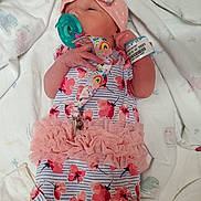 Avalynn joined the competition — help win amazing prizes! baby, newborn, infant, pacifier, onesie, headband, hospital_bracelet, blanket, pink, floral, tutu, sleeping, lying_down, cute, child, small_hand, soft, adorable, person, newborn_clothing
