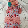 baby, newborn, infant, pacifier, onesie, headband, hospital_bracelet, blanket, pink, floral, tutu, sleeping, lying_down, cute, child, small_hand, soft, adorable, person, newborn_clothing