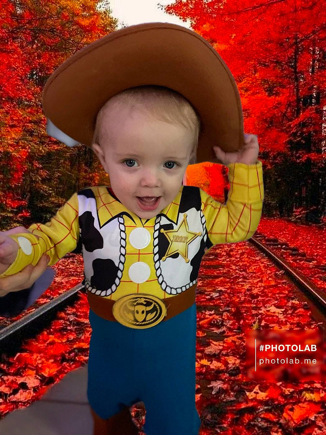 Kash is registered to the contest to win money with this photo: art, baby, baby_toddler_clothing, child, costume_hat, grass, happy, hat, leaf, orange, outerwear, people_in_nature, person, plant, product, sleeve, smile, sun_hat, toddler, tree