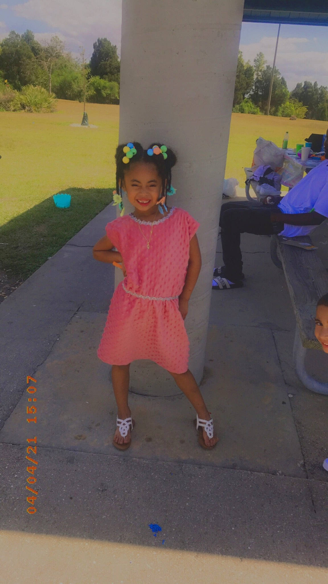 Gabriella Santiago is registered to the contest to win money with this photo: asphalt, child, event, fun, grass, happy, joy, landscape, leisure, magenta, person, pink, plant, public_space, recreation, road_surface, sandal, shoe, sidewalk, standing