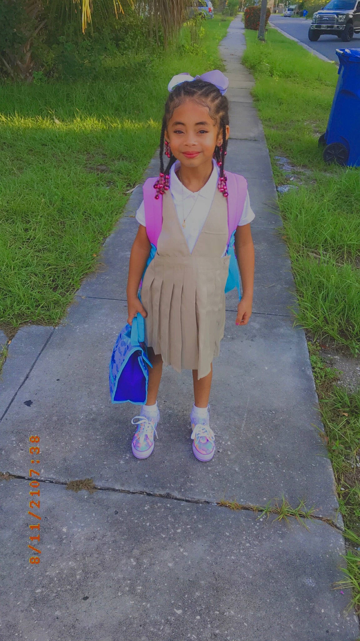 Gabriella Santiago is registered to the contest to win money with this photo: asphalt, baby_toddler_clothing, child, dress, electric_blue, fun, grass, happy, human_leg, joy, leisure, magenta, person, pink, purple, recreation, road_surface, sidewalk, smile, snapshot