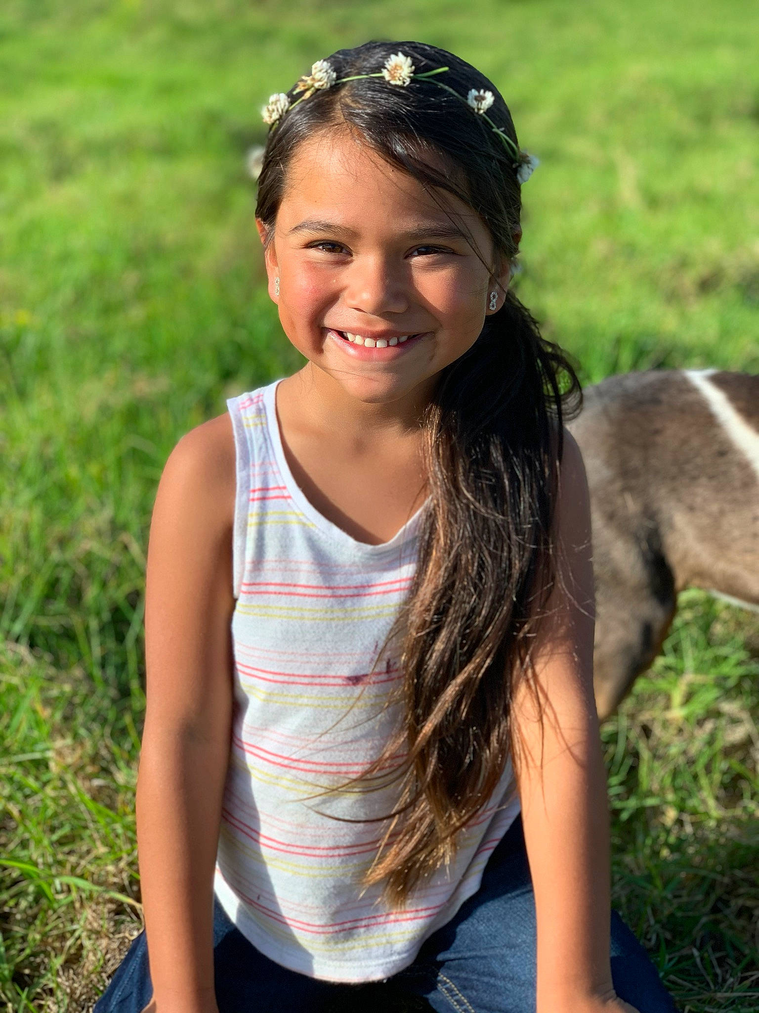 Faith-ann is registered to the contest to win money with this photo: black_hair, brown_hair, child_model, fawn, grass, hair, hair_accessory, hairstyle, headband, joy, long_hair, person, photography, smile