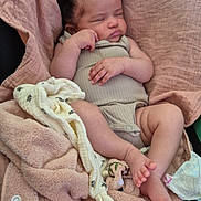 Lylah participe au concours pour gagner de l'argent avec cette photo : baby, blanket, child, clothing, comfort, cozy, cute, fabric, feet, hands, indoors, infant, nap, peaceful, portrait, relaxation, resting, seat, sleeping, soft