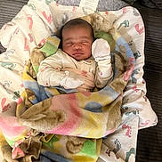 Princess joined the competition — help win amazing prizes! infant, baby, sleeping, blanket, mittens, cushion, footprint_pattern, cozy, resting, swaddled, soft, indoors, portrait, child, small, cute, peaceful, comfort, fabric, closeup