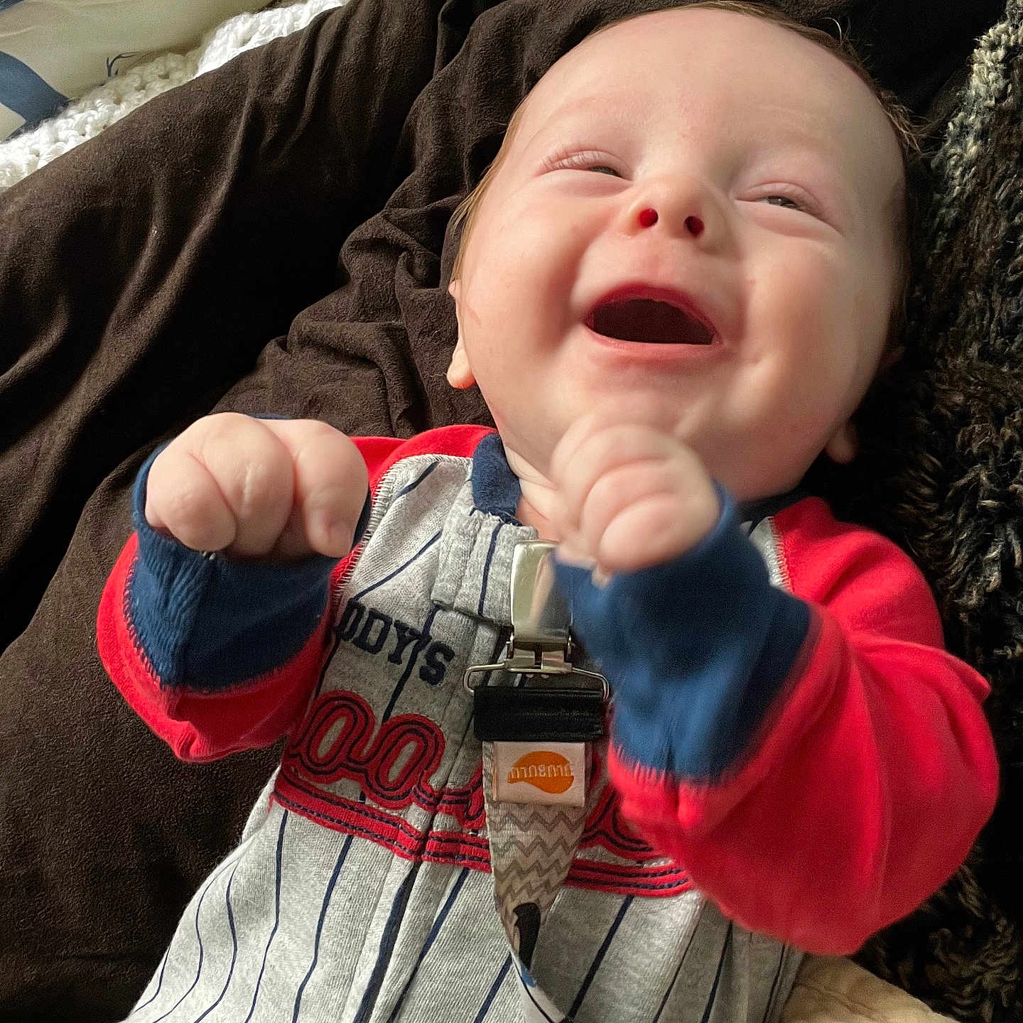 Dean joined the competition — help win amazing prizes! baby, bodypart, clothing, coat, couch, cushion, face, finger, furniture, glove, hand, happy, head, homedecor, jacket, laughing, pants, person, photography, portrait
