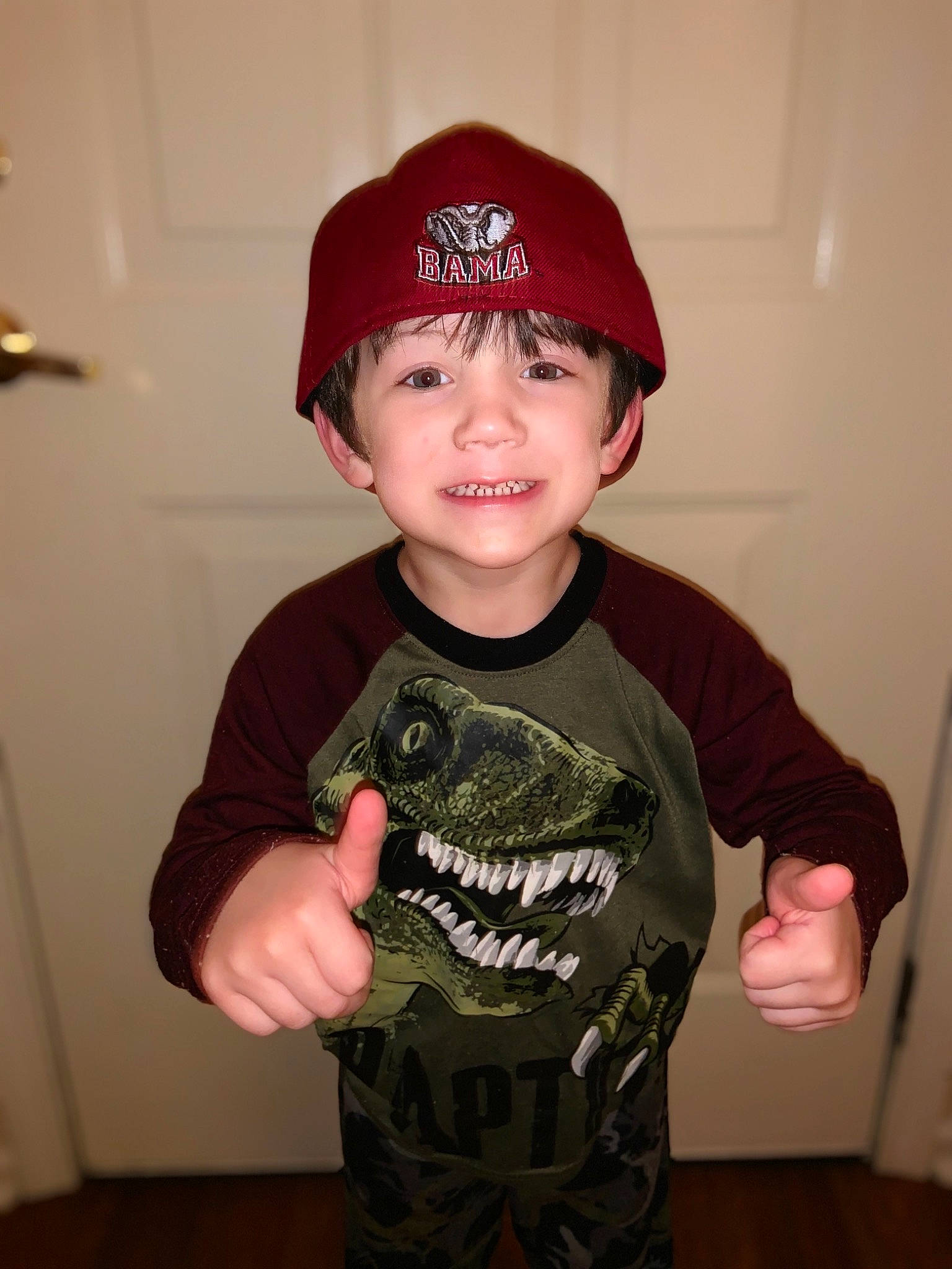 Jake is registered to the contest to win money with this photo: baseball_cap, cap, child, cool, hat, headgear, headwear, joy, person, sleeve, t_shirt, toddler