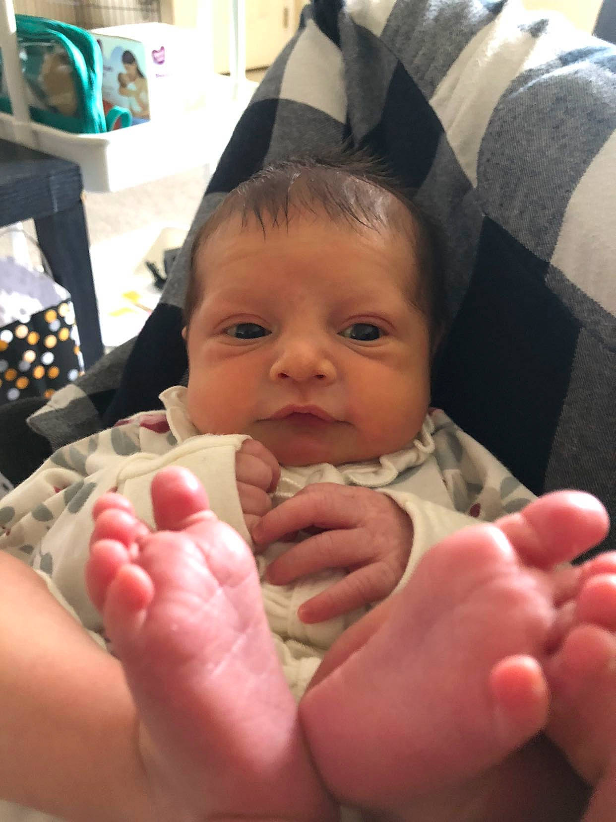 Adelynn is registered to the contest to win money with this photo: baby, barefoot, cheek, child, comfort, finger, foot, fun, gesture, hand, happy, head, human_body, lap, leg, mouth, nail, person, skin, thumb