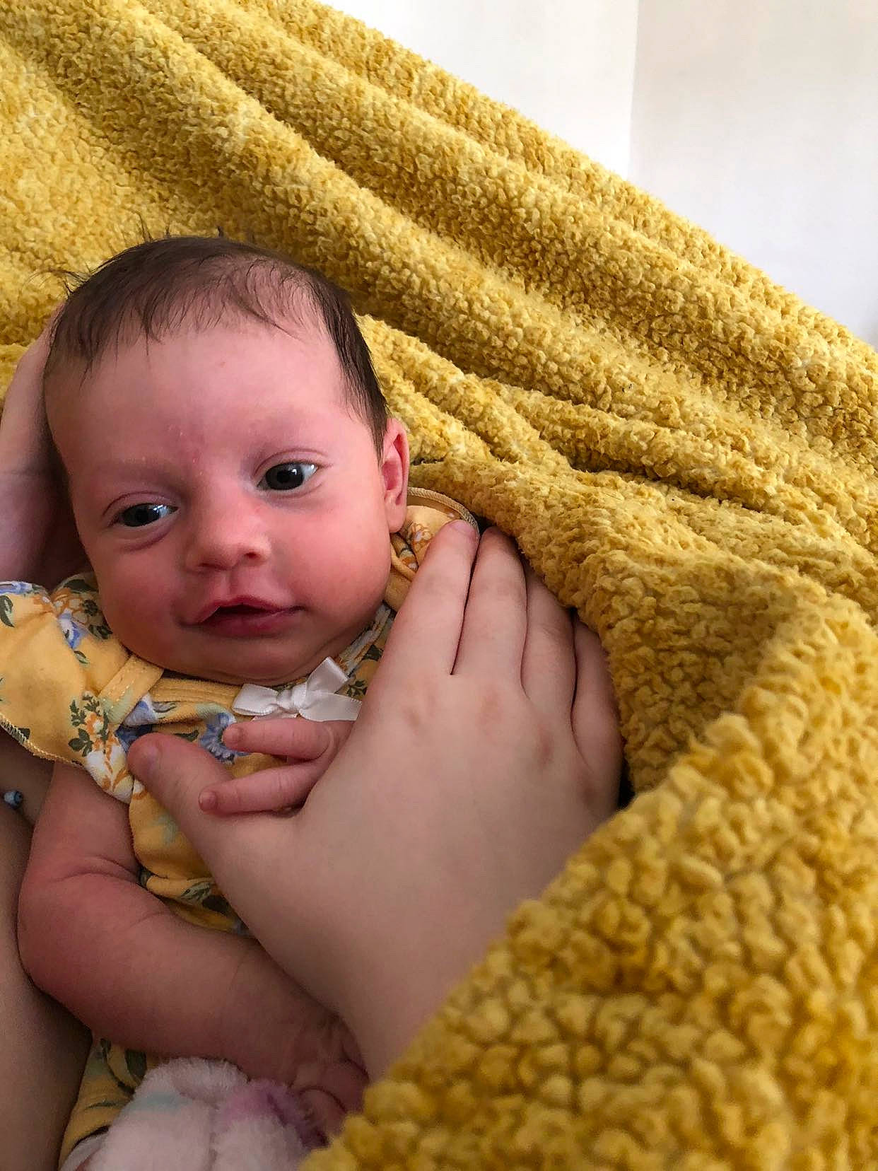 Adelynn is registered to the contest to win money with this photo: baby, baby_toddler_clothing, cheek, child, comfort, eye, finger, foot, gesture, grass, hand, happy, iris, linens, nail, person, sitting, skin, thumb, toddler