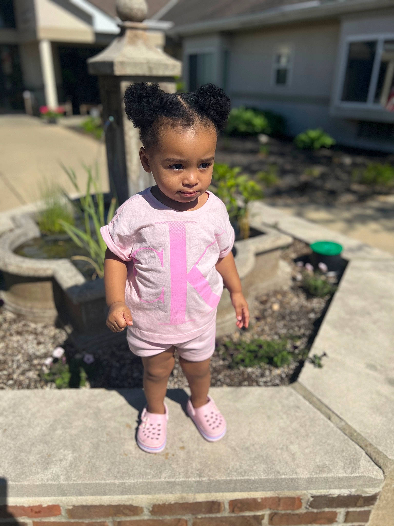 Sarai joined the competition — help win amazing prizes! baby, baby_toddler_clothing, child, chin, facial_expression, flowerpot, fun, garden, grass, hair, happy, head, house, houseplant, leisure, people_in_nature, person, plant, shorts, summer