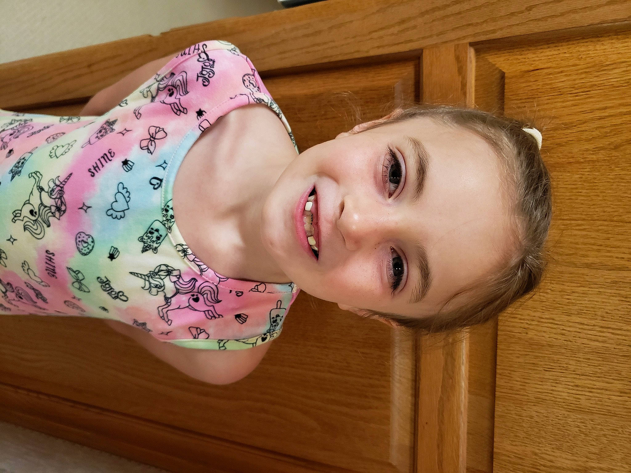 Lucy is registered to the contest to win money with this photo: bangs, cheek, eye, eyelash, face, flooring, happy, human_body, iris, jaw, joy, lip, long_hair, neck, nose, person, shoulder, skin, sleeve, smile