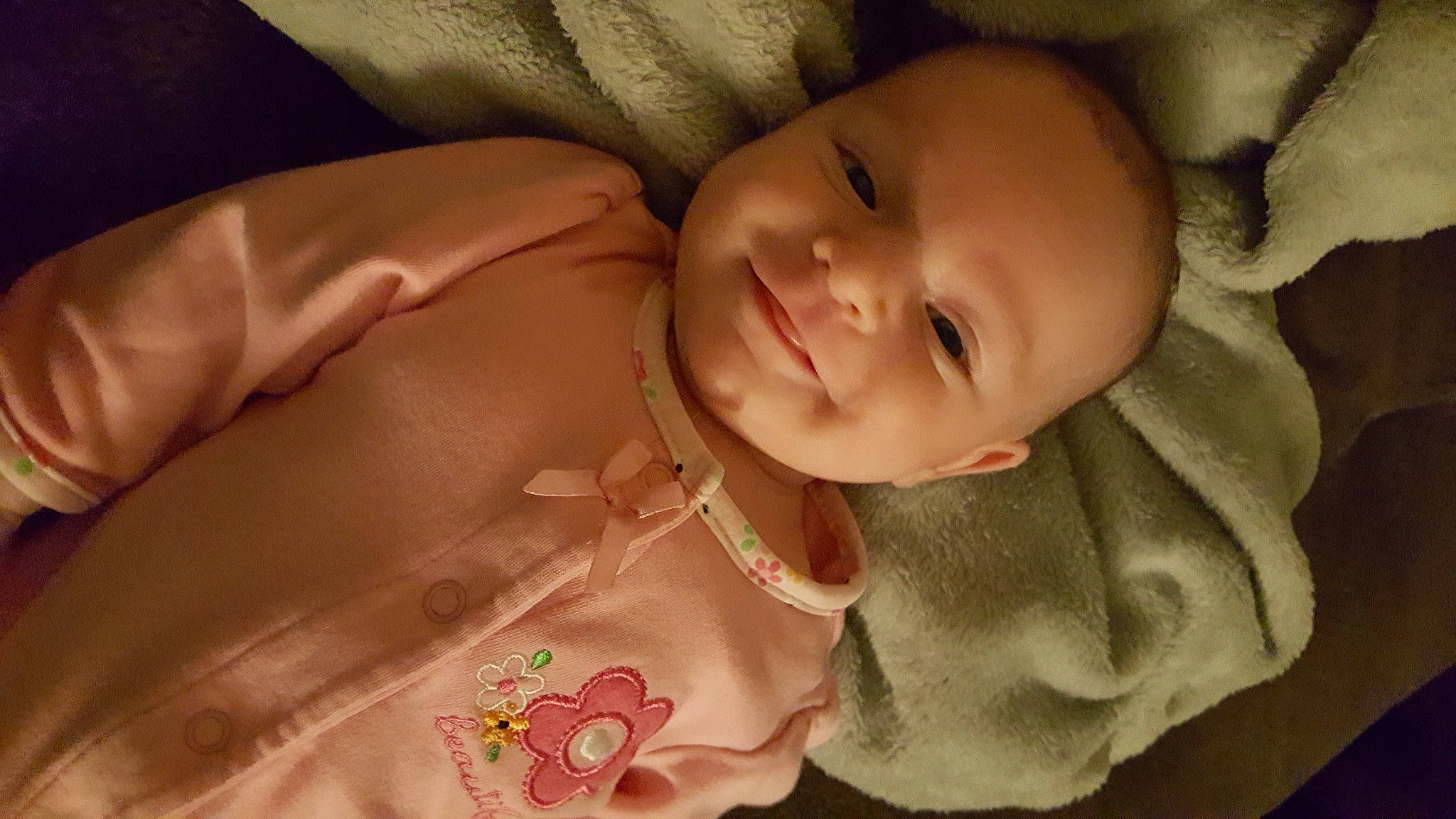 Carlie is registered to the contest to win money with this photo: baby, cheek, chin, comfort, ear, eye, eyebrow, face, facial_expression, finger, forehead, head, human_body, iris, joy, lip, mouth, neck, nose, person