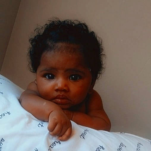 Laura joined the competition — help win amazing prizes! baby, black_hair, cheek, child, chin, eyebrow, eyelash, forehead, hairstyle, iris, linens, neck, no_expression, nose, organ, paper_product, person, portrait_photography, shoulder, skin