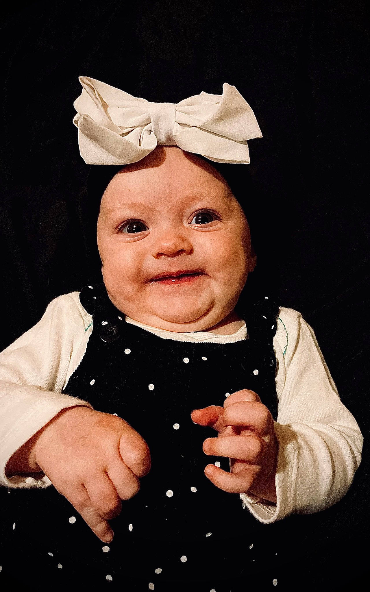 Oaklynn is registered to the contest to win money with this photo: art, baby, baby_toddler_clothing, child, costume_hat, facial_expression, fun, gesture, hand, happy, hat, headgear, headwear, human_body, joy, party_supply, person, pink, sleeve, smile