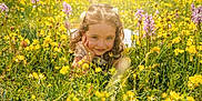 Jade participe au concours pour gagner de l'argent avec cette photo : child, girl, wildflowers, yellow_flowers, purple_flowers, meadow, nature, sunlight, smile, flowers, greenery, spring, outdoor, hair_clips, white_dress, grass, portrait, happy, face, young