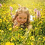 child, girl, wildflowers, yellow_flowers, purple_flowers, meadow, nature, sunlight, smile, flowers, greenery, spring, outdoor, hair_clips, white_dress, grass, portrait, happy, face, young
