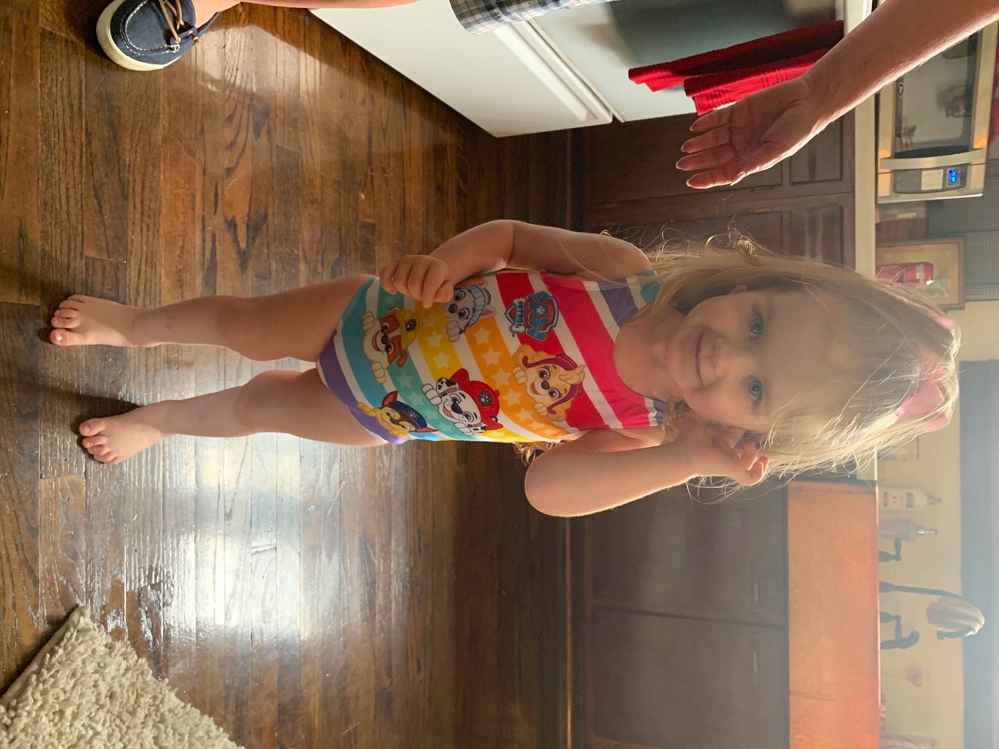 Kinley is registered to the contest to win money with this photo: baby, baby_toddler_clothing, blurred, child, dress, elbow, flooring, foot, fun, happy, hardwood, hat, human_leg, joy, knee, leisure, person, room, smile, standing