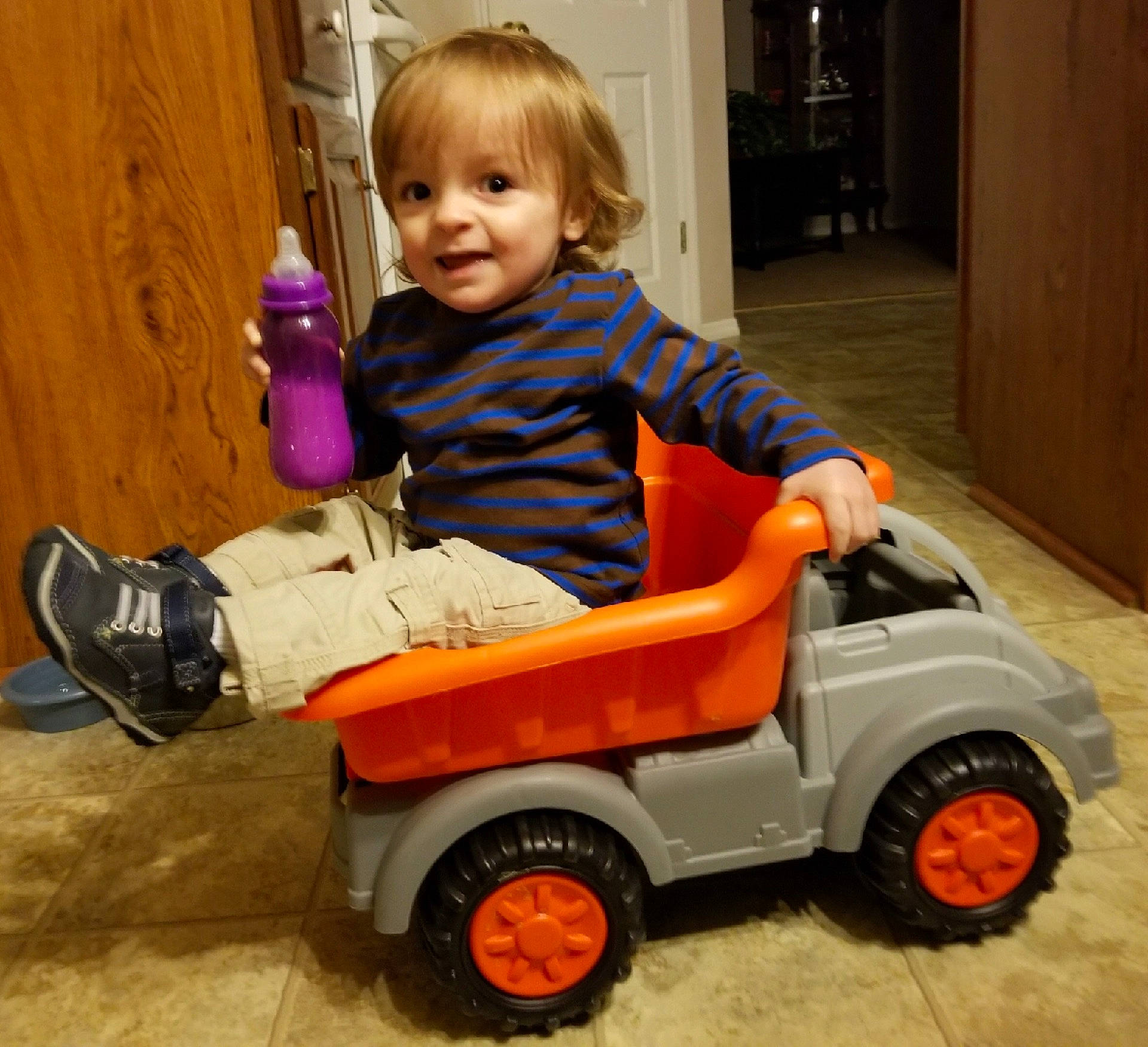 Mason is registered to the contest to win money with this photo: car, child, motor_vehicle, person, play, product, toddler, toy, vehicle