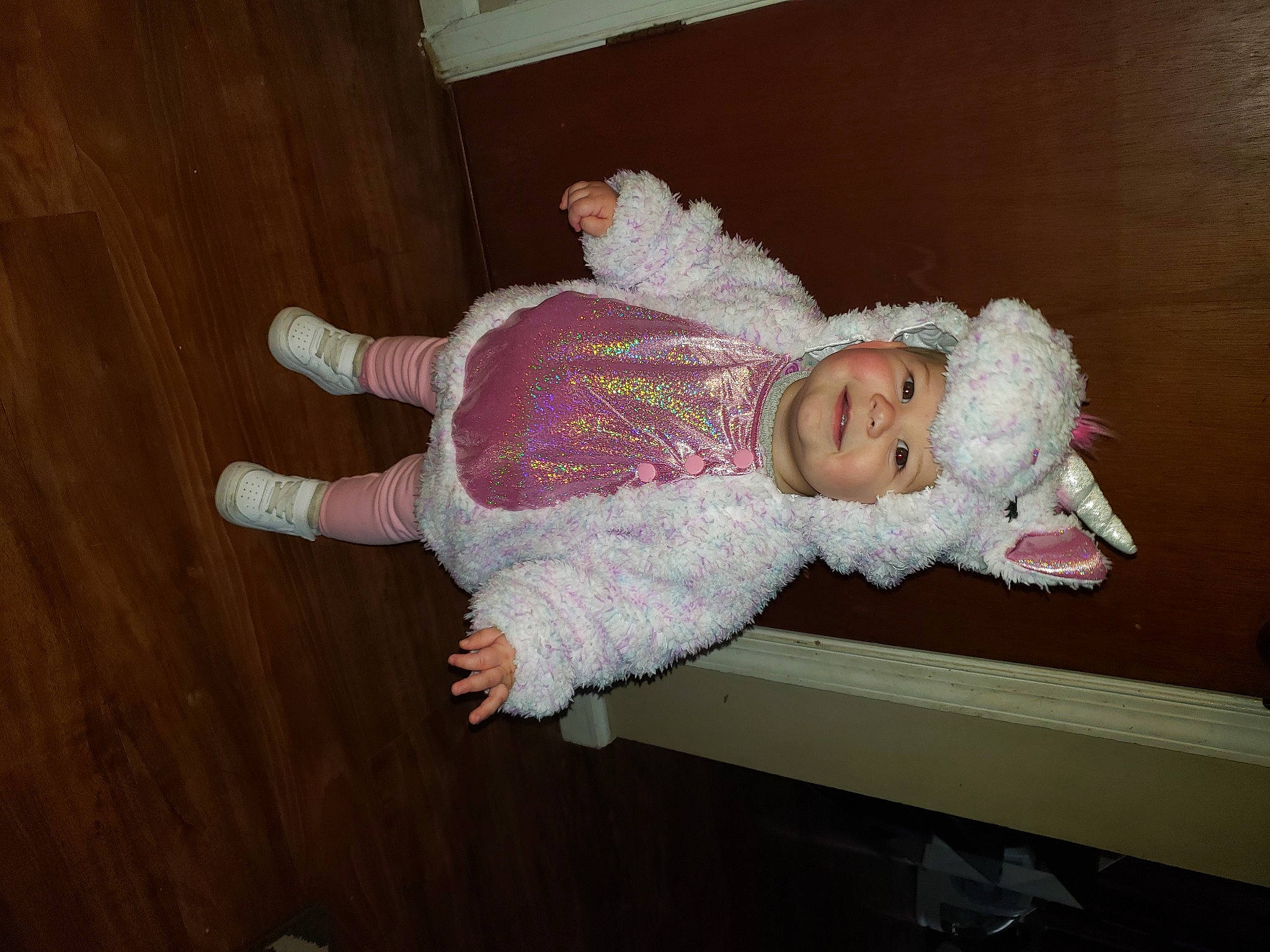 Nina is registered to the contest to win money with this photo: baby, baby_toddler_clothing, child, comfort, creative_arts, embellishment, flooring, fur, hardwood, headwear, joy, pattern, person, room, sitting, sleeve, toddler, varnish, wood, wood_flooring