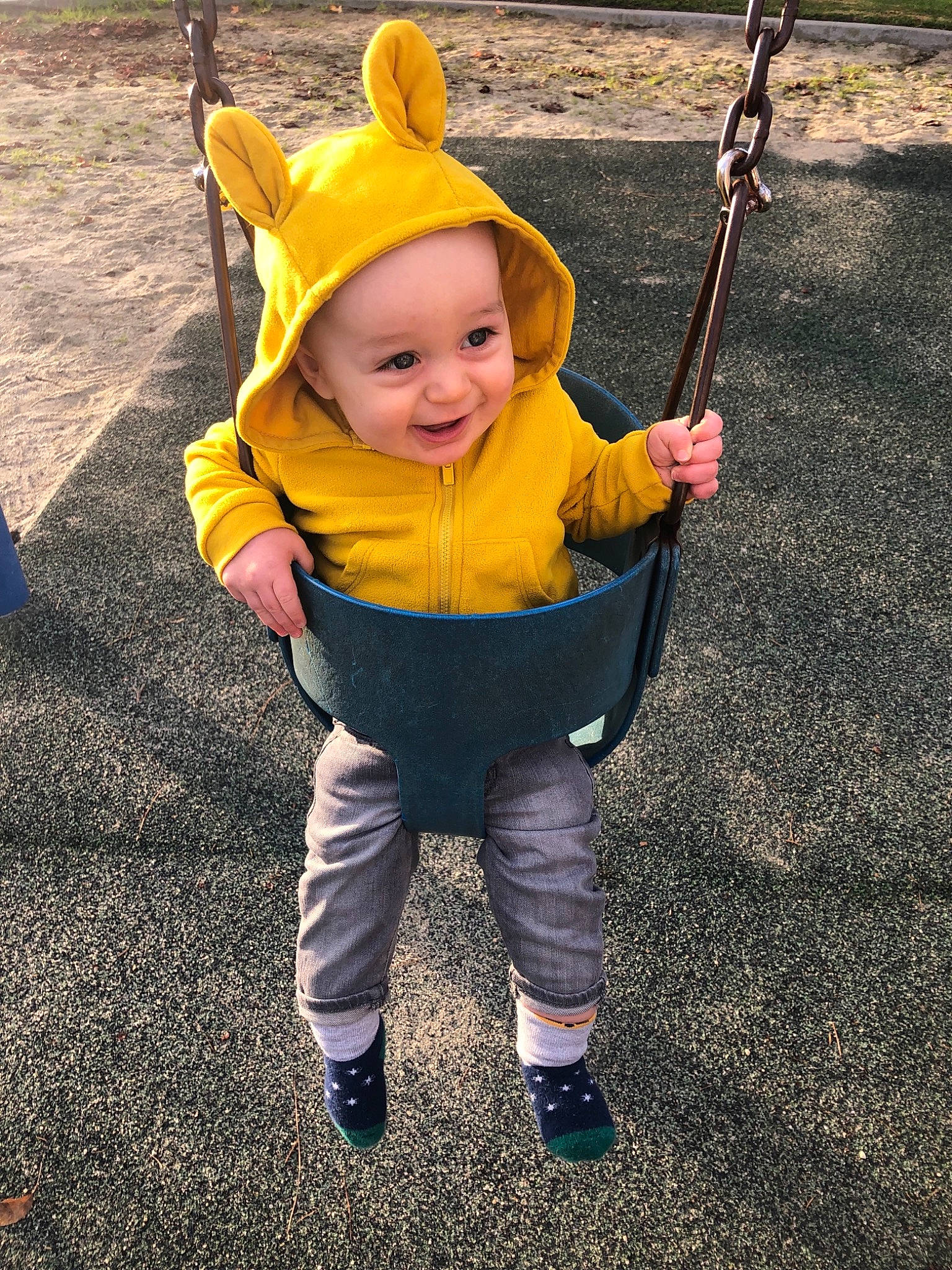 Sullivan is registered to the contest to win money with this photo: child, clothing, costume, fun, headgear, joy, outdoor_play_equipment, outerwear, person, play, product, smile, toddler, vacation, yellow