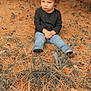 Legacy is registered to the contest to win money with this photo: child, toddler, curly_hair, sitting, forest_floor, pine_needles, leaves, autumn, nature, outdoor, black_shirt, blue_jeans, thoughtful, fall_colors, grass, ground, young_child, casual_clothing, daylight, portrait