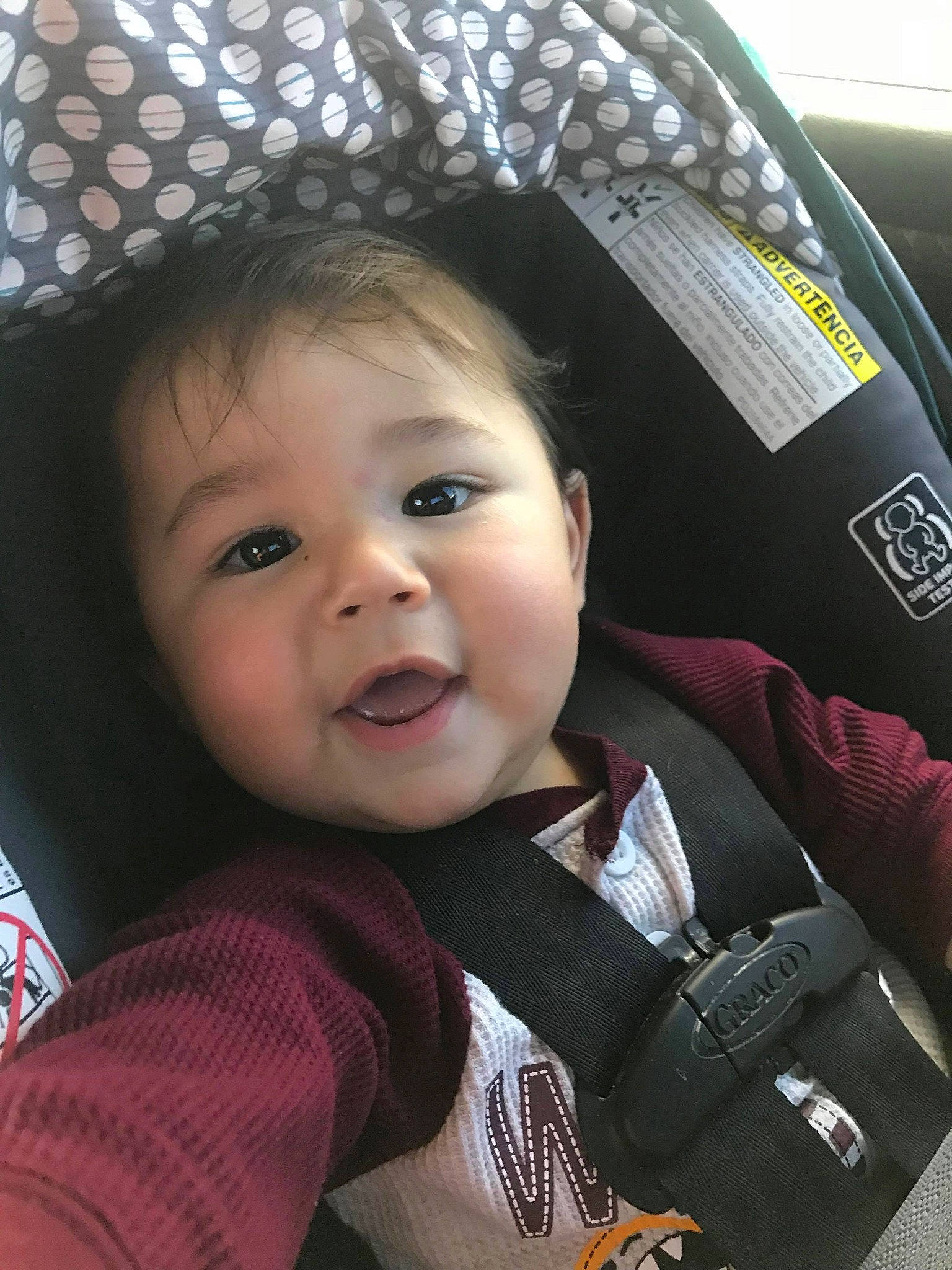 Dezmond is registered to the contest to win money with this photo: baby, baby_carriage, baby_in_car_seat, baby_products, cap, car_seat, child, headgear, person, product, smile, toddler