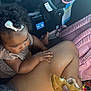 Akarii joined the competition — help win amazing prizes! baby, bow, burger, candid, car_seat, casual, child, clothing, curiosity, curly_hair, fingers, food, hand, indoor, leg, person, pink, seatbelt, skin, toddler